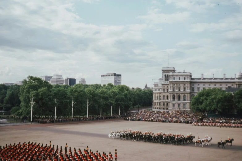 a group of military men are standing in front of the large building