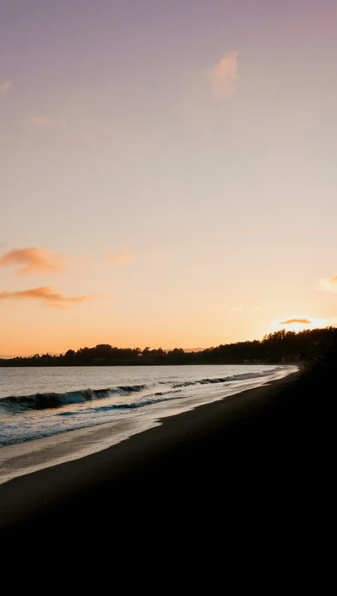 the sun sets over the beach on the other side