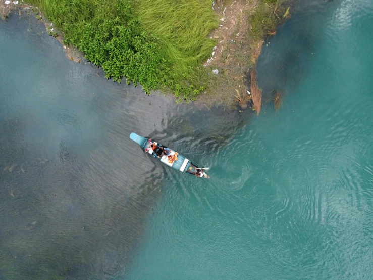 two canoers paddling across the water