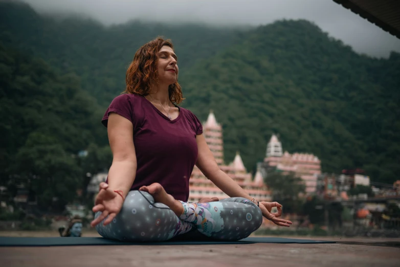 a woman is in the middle of doing yoga