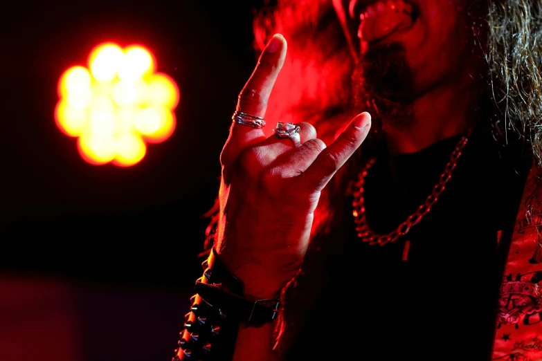 an image of a man making the middle finger gesture