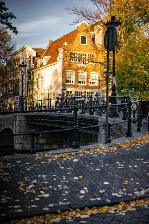 a bridge crossing over a river between some buildings