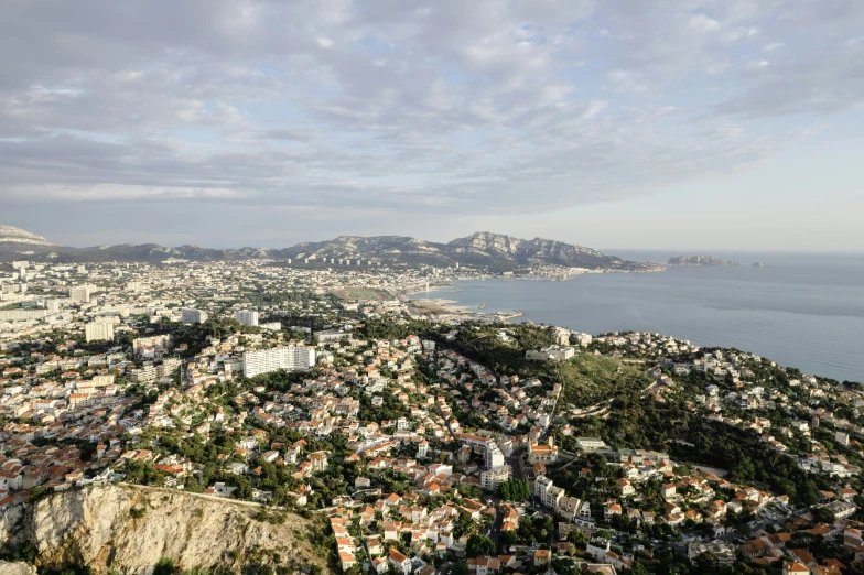 an aerial view of the city of a city next to the ocean