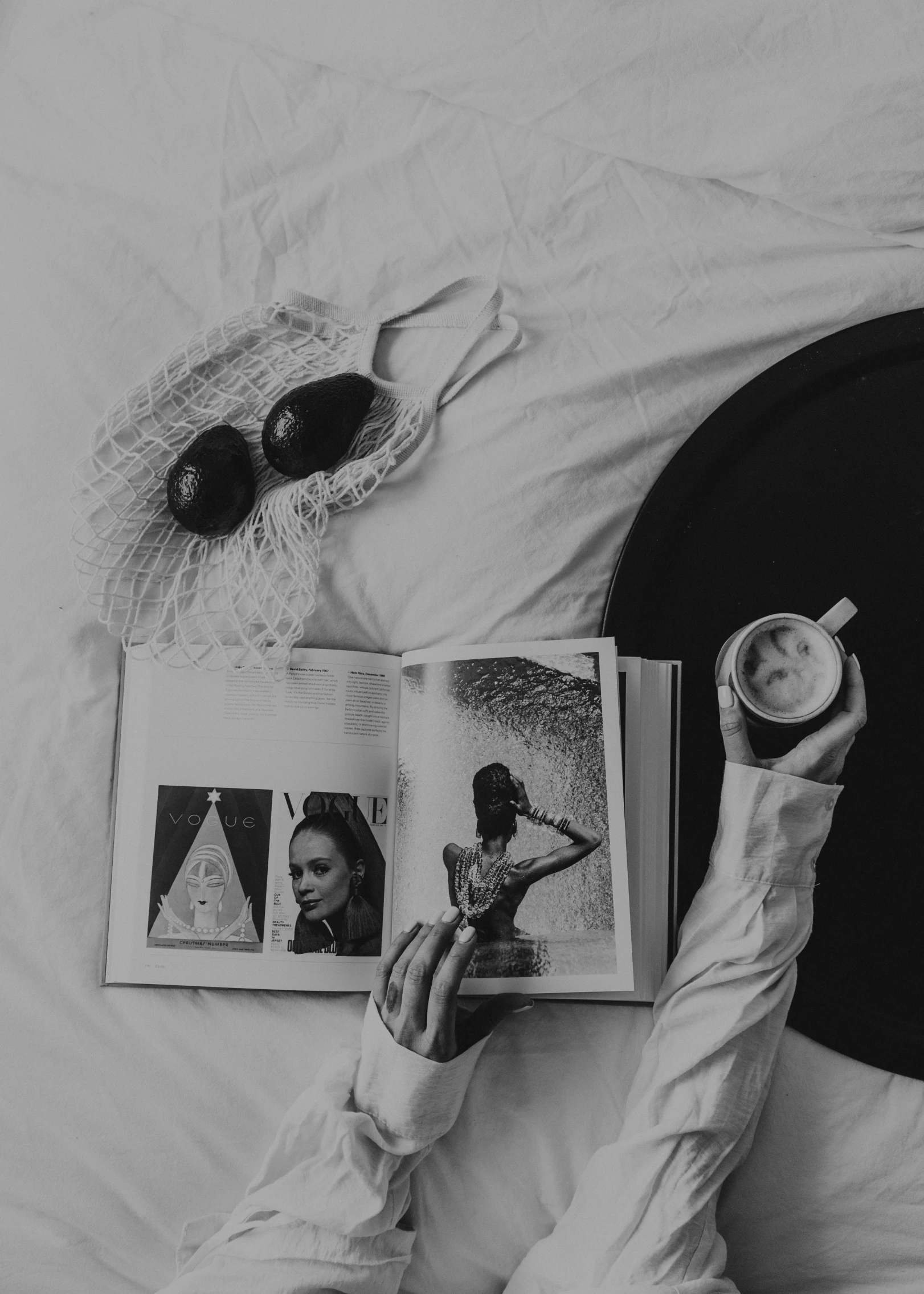 the lady is reading book on the bed