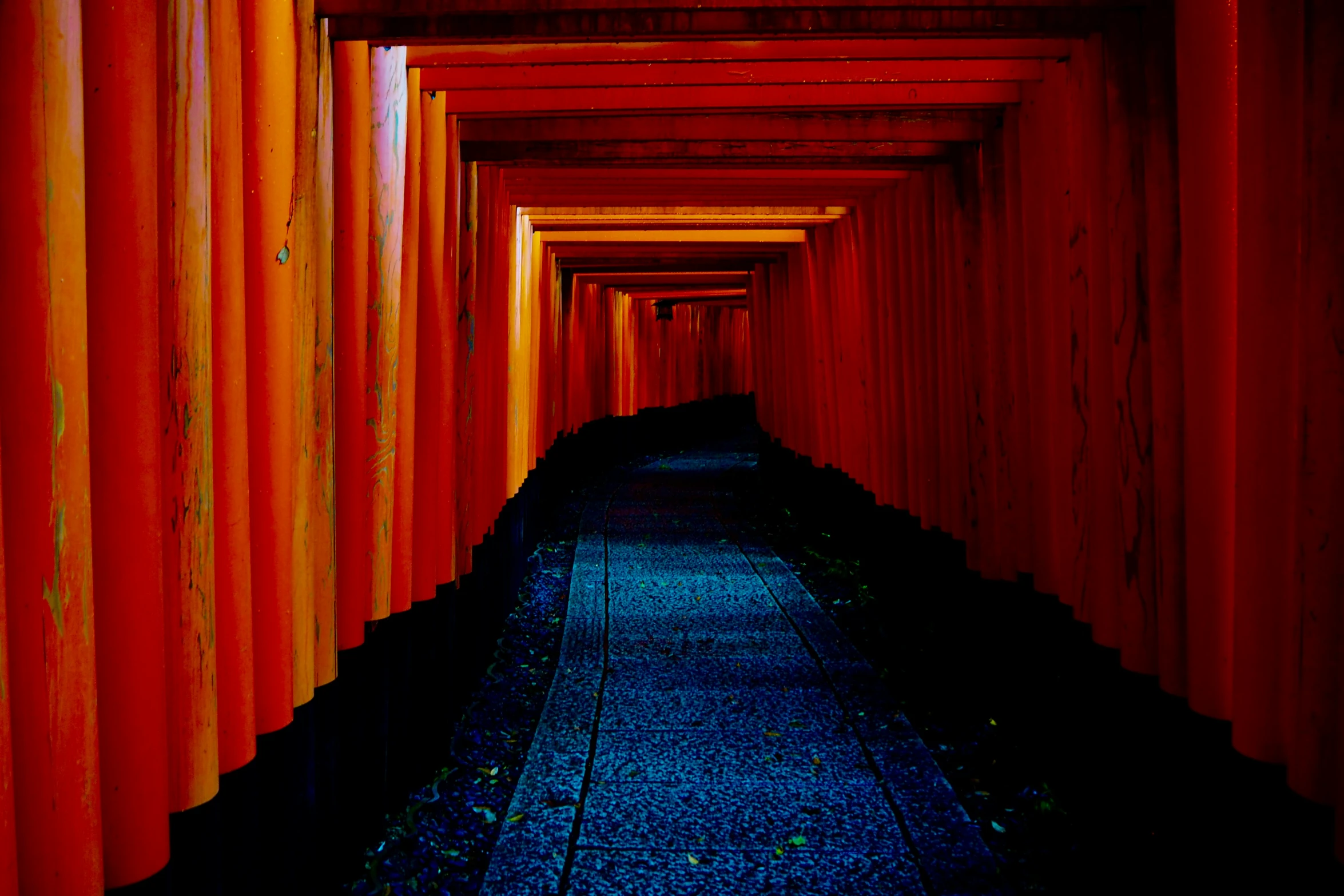 an image of a long path between buildings