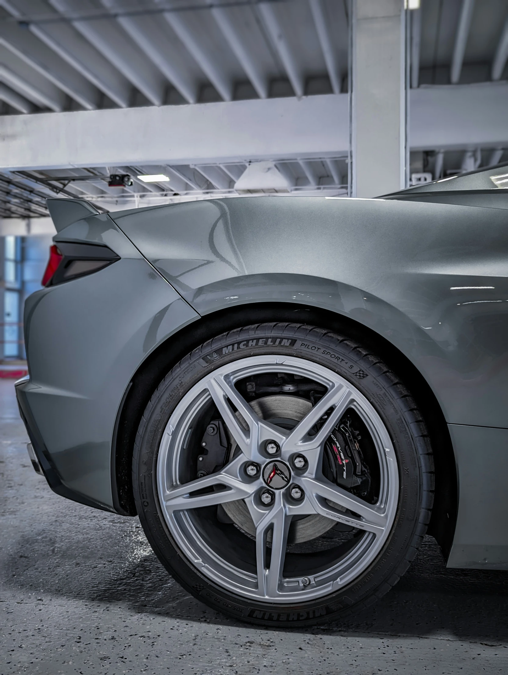 a car is shown in a parking garage