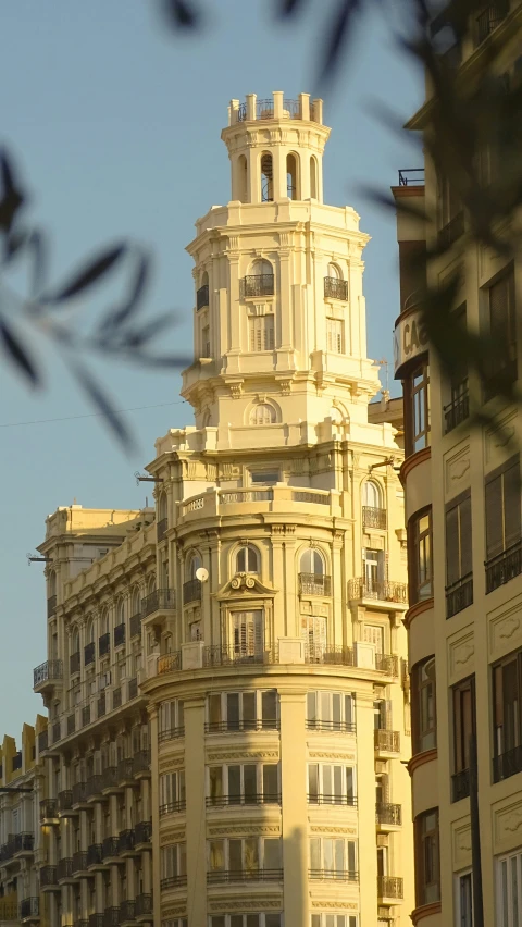 a large building surrounded by lots of tall buildings