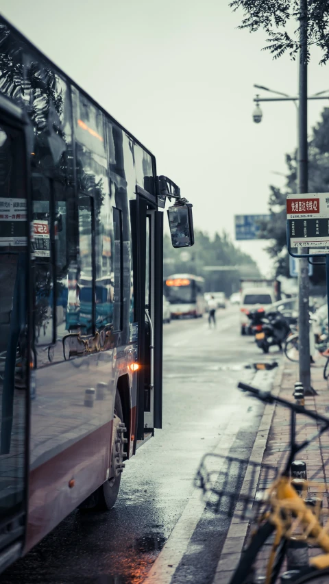 the back of a city bus on the side of a street