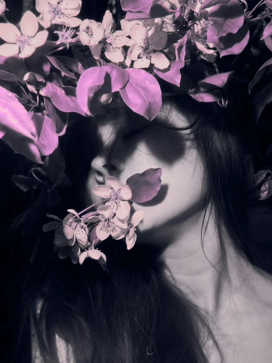 a woman with flowers on her head, and eyes close to the camera