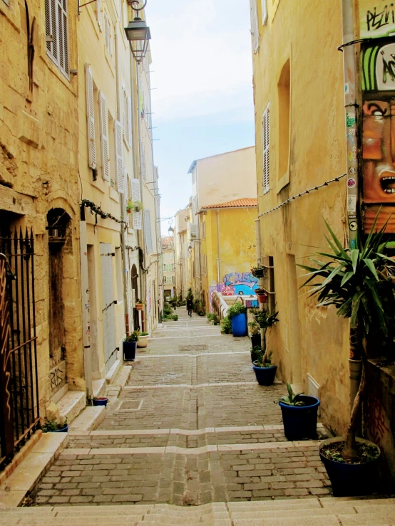 several buildings in the background and a brick sidewalk