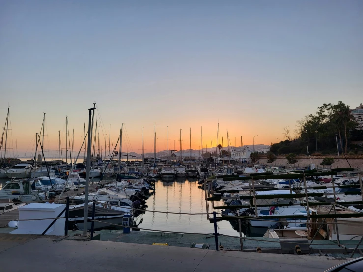 a group of boats sitting at the dock