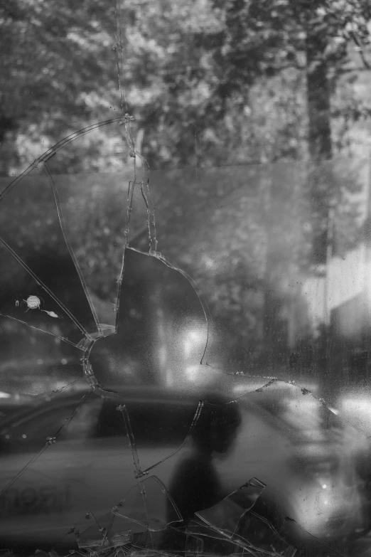 the broken windshield is seen in black and white