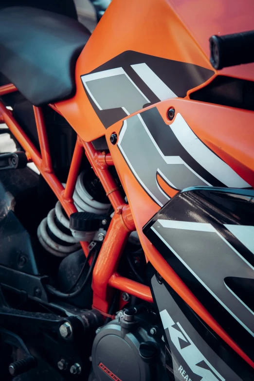 an orange and black motorcycle with black accents