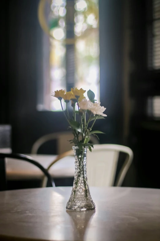 flowers are in a vase on the table