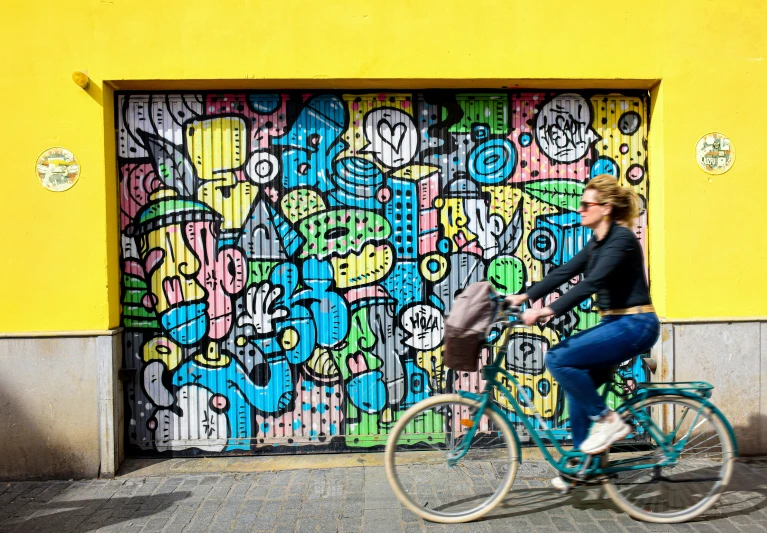 there is a girl that is riding on a bike