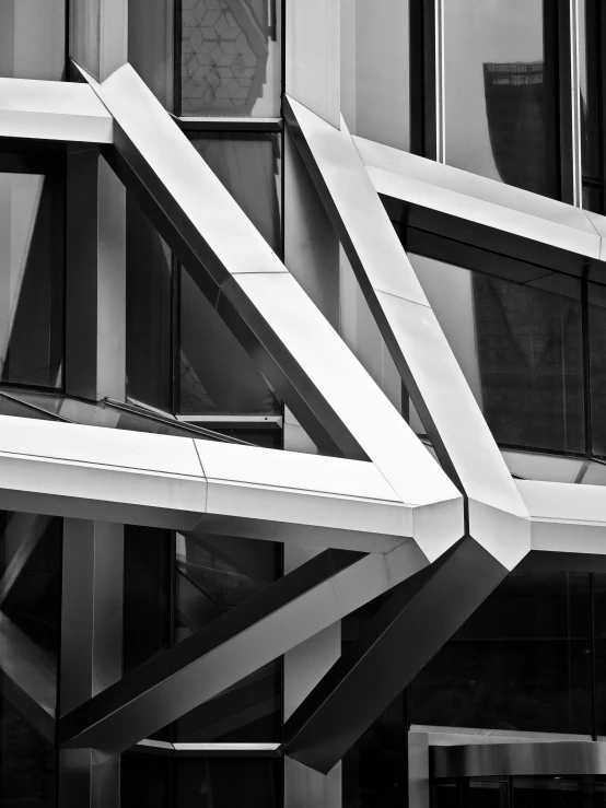 a modern building with a mirrored window, and abstract architecture