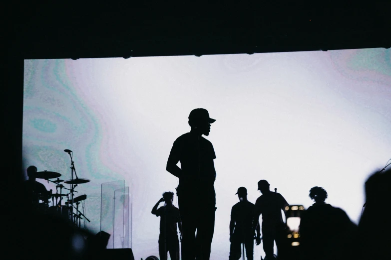 a crowd of people standing on top of a stage