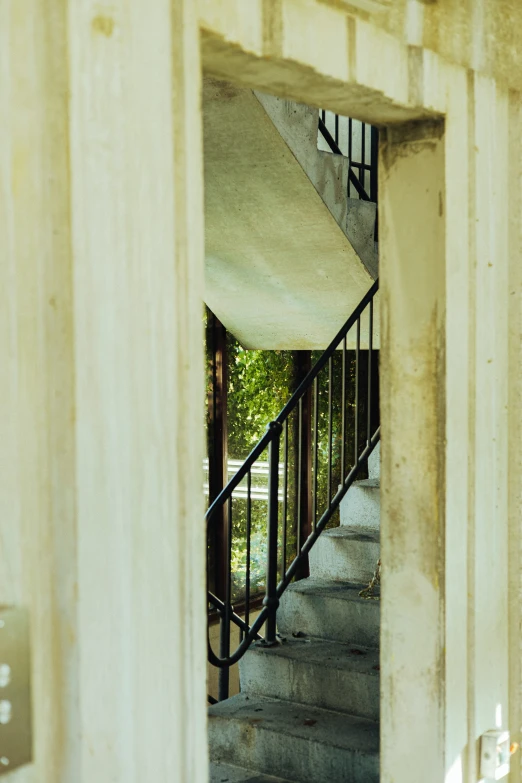 view of stairs from below inside an open stairwell