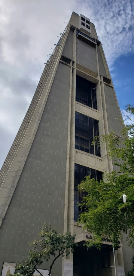 this building is very tall and has a clock on top