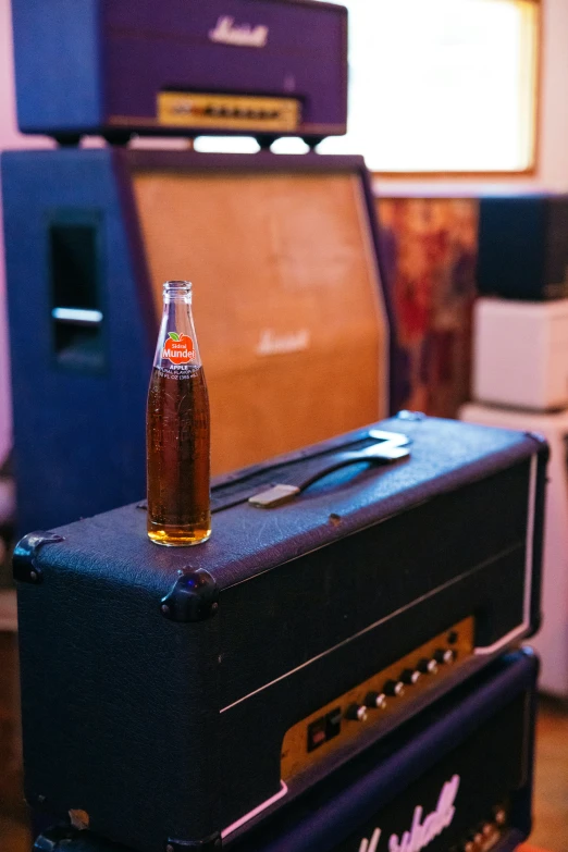 some type of amp with a beer in a bottle