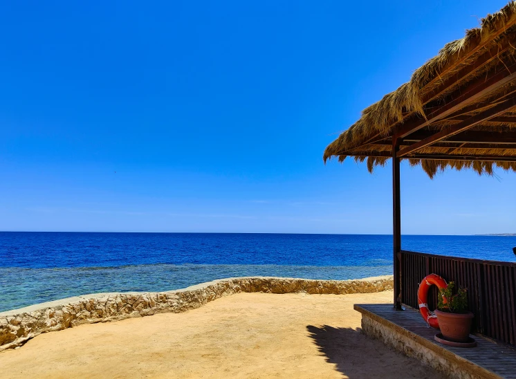 a beach view with umbrellas that are open