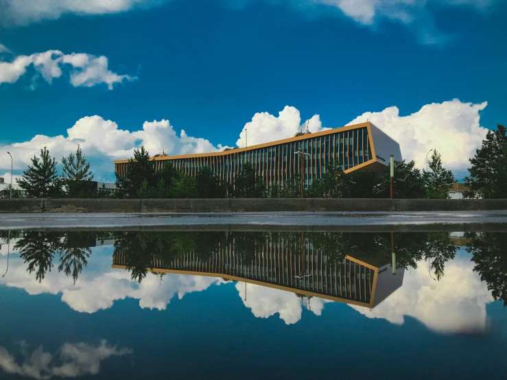 the reflection of a building in the water