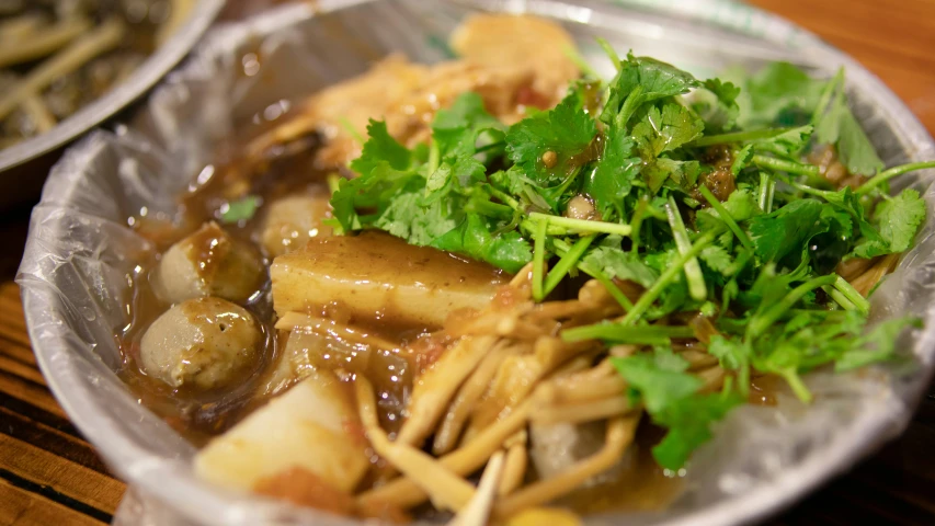 a plate of food with broccoli and mushrooms