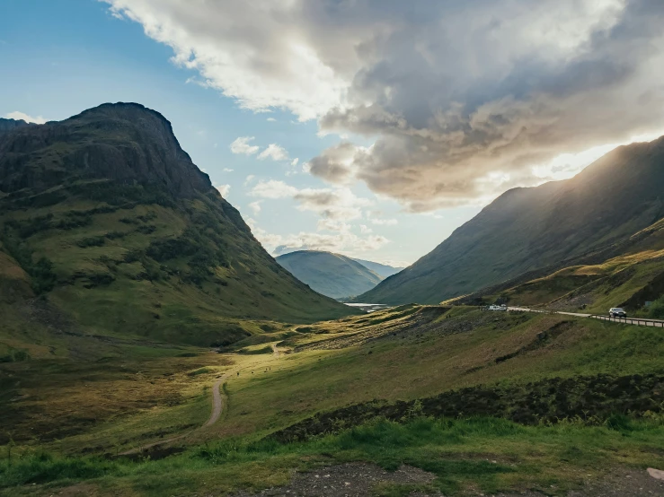 the mountain view of a roadway in a scenic country area