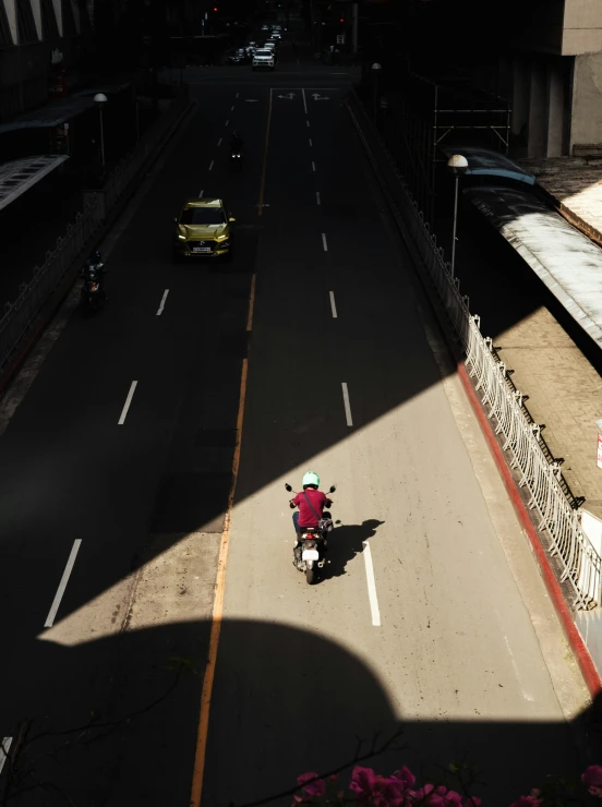 a person riding a motorcycle down a highway