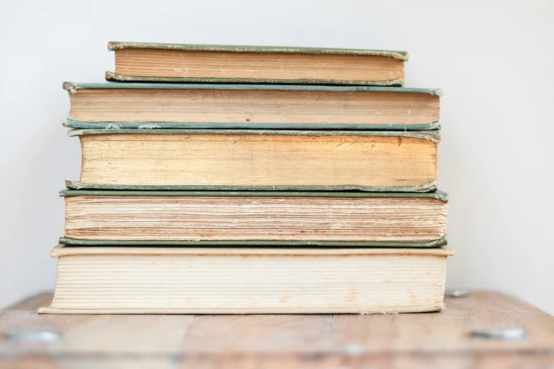 several stacks of books sit next to each other