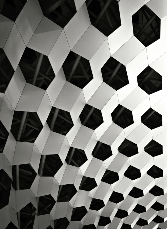 the interior of an artistic building in black and white