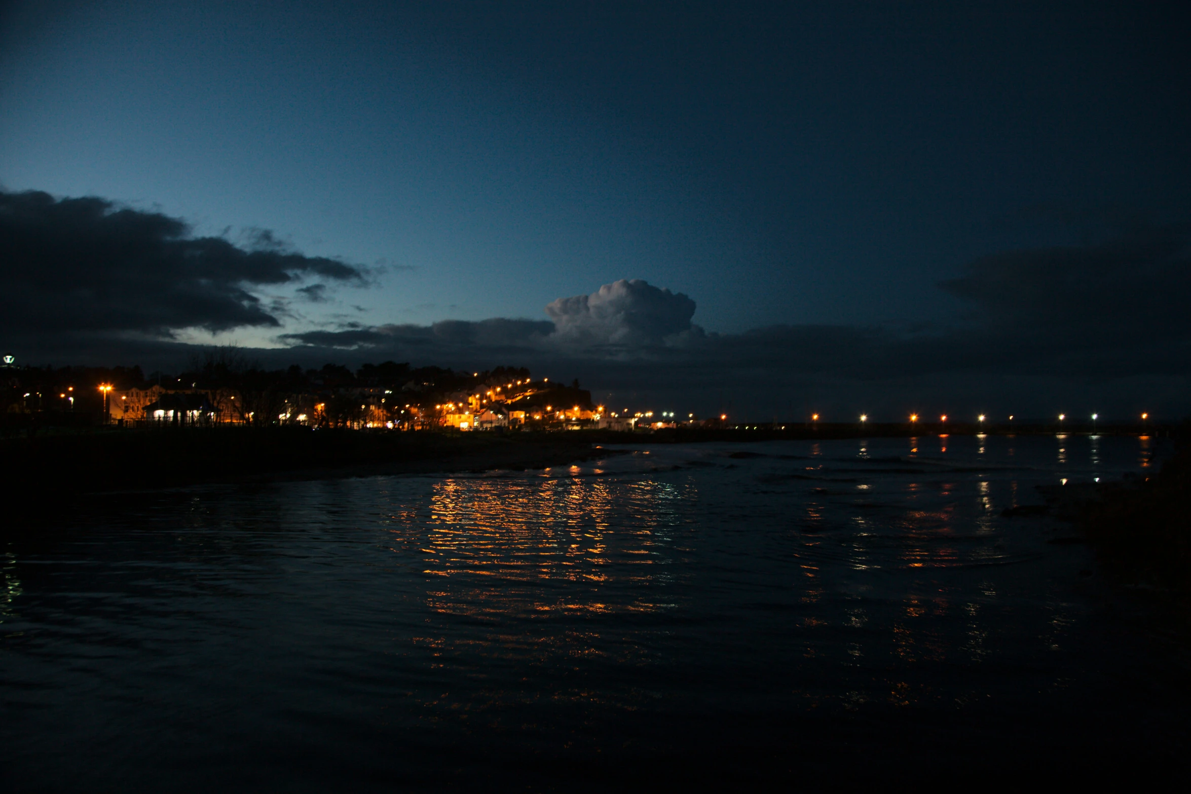 the bright lights of an area of town lite up at night