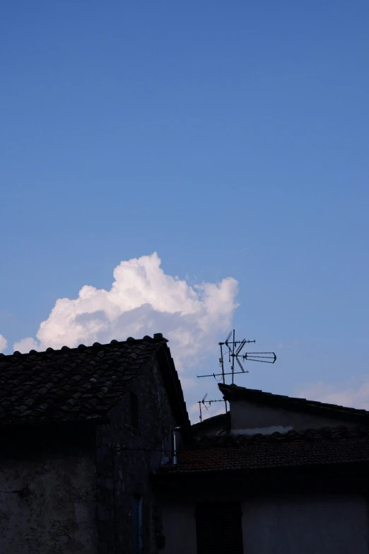 a very tall building with some weather vane attached to it