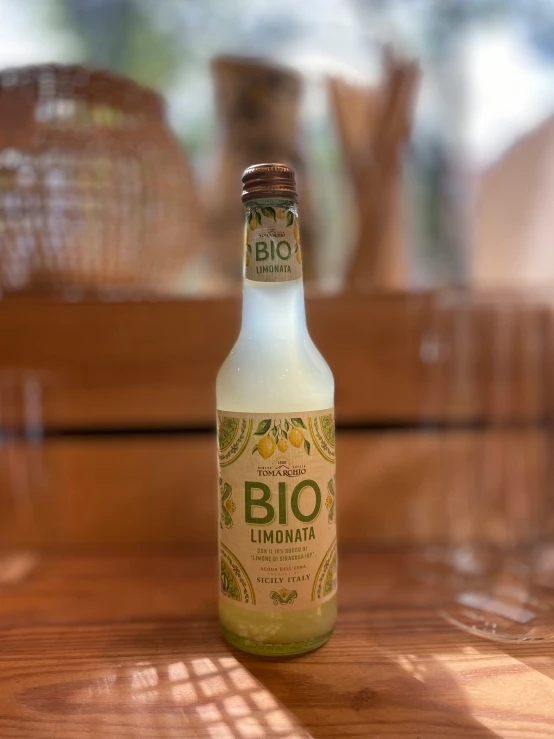 a bottle of alcohol sitting on a wooden table