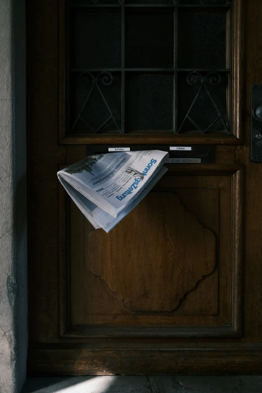 a wooden door with some papers hanging on it