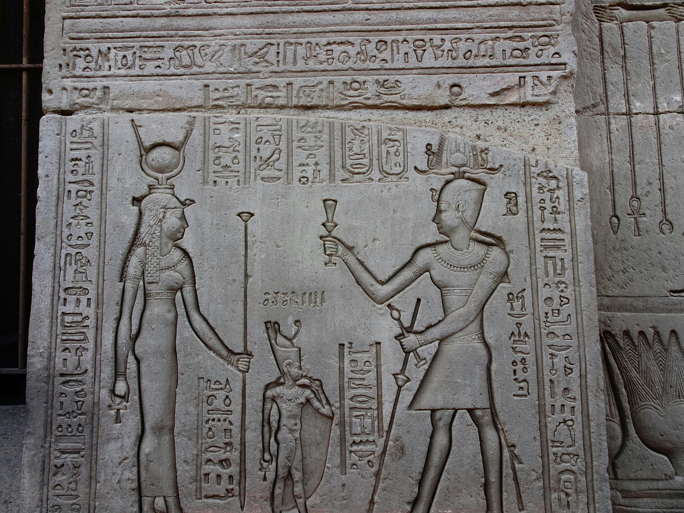 an ancient carving of egyptian pharaohs and their animals