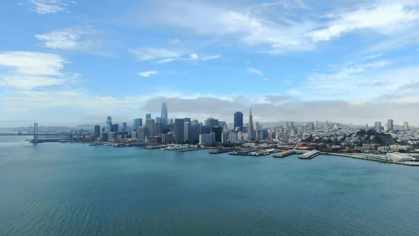 an aerial view of a city with its harbor and city skyline