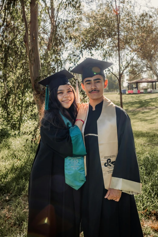 an asian couple poses for a po together at graduation