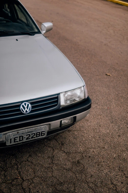 a volkswagen car parked on top of a parking lot