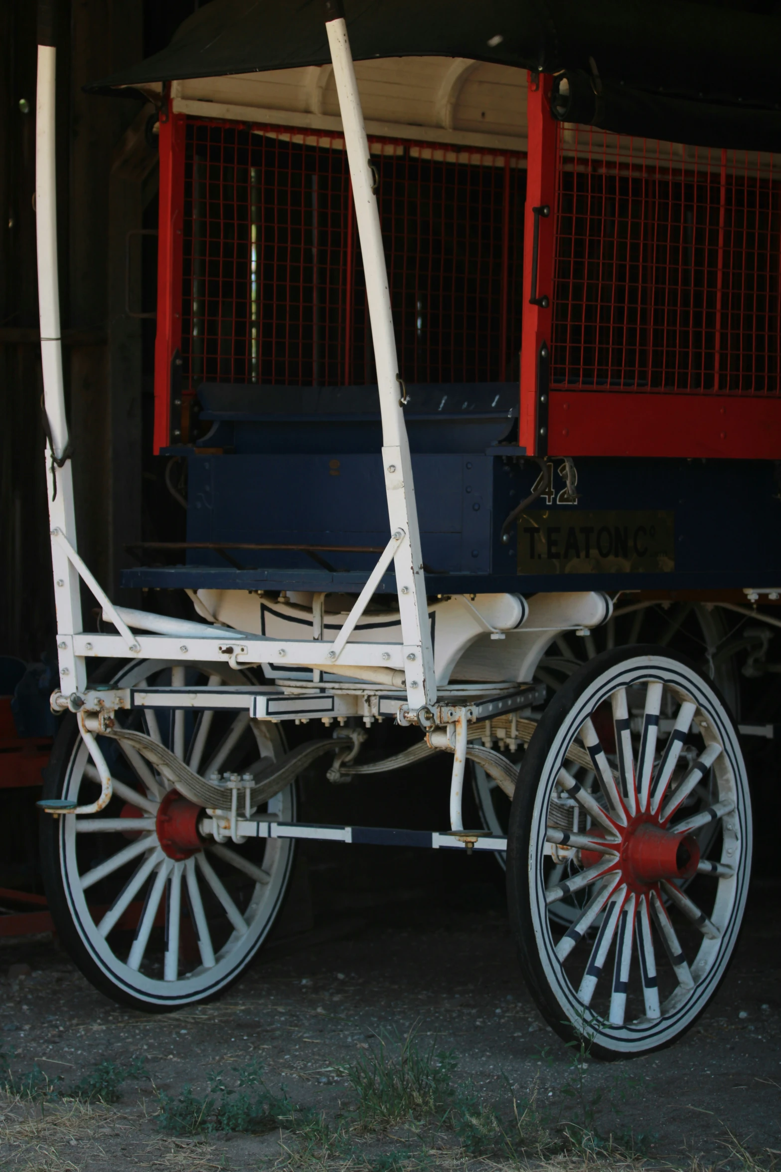 there is a small white cart attached to a blue train