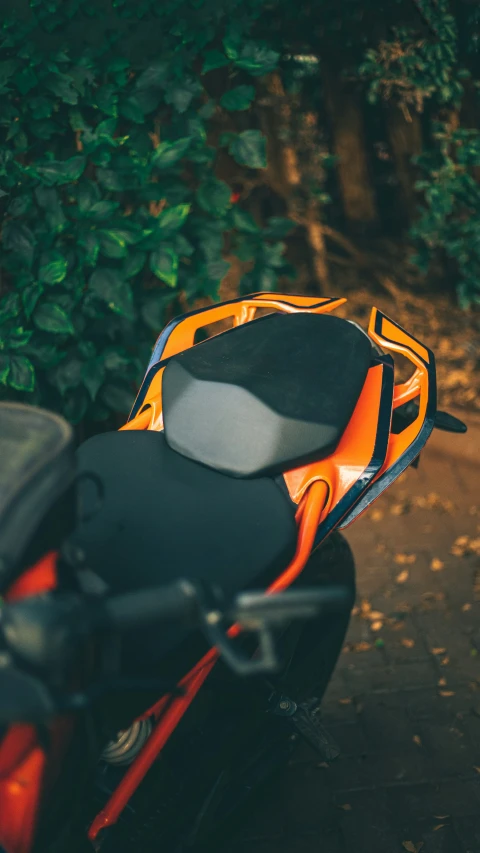 a backpack is sitting on the back of a motorcycle