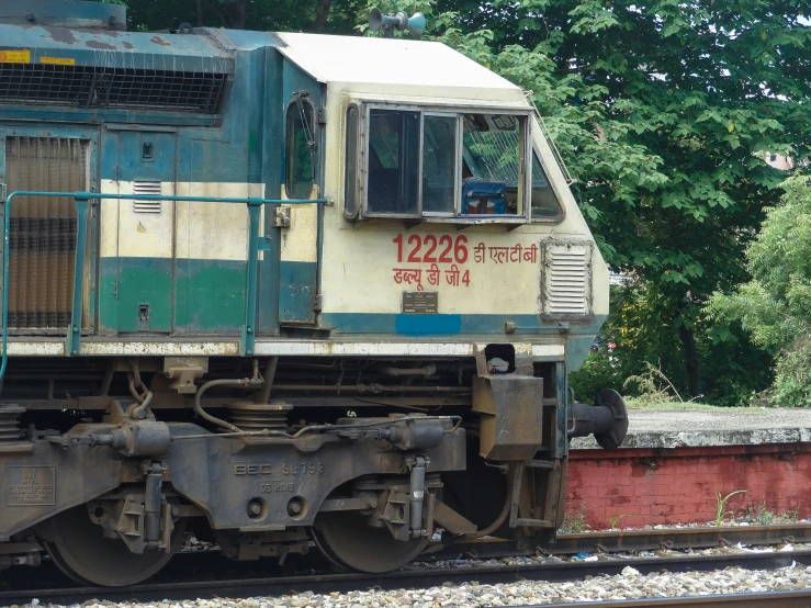 an old train engine sitting on the tracks