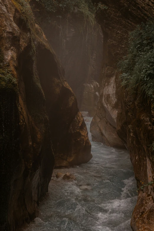 water in a narrow waterfall and a bridge