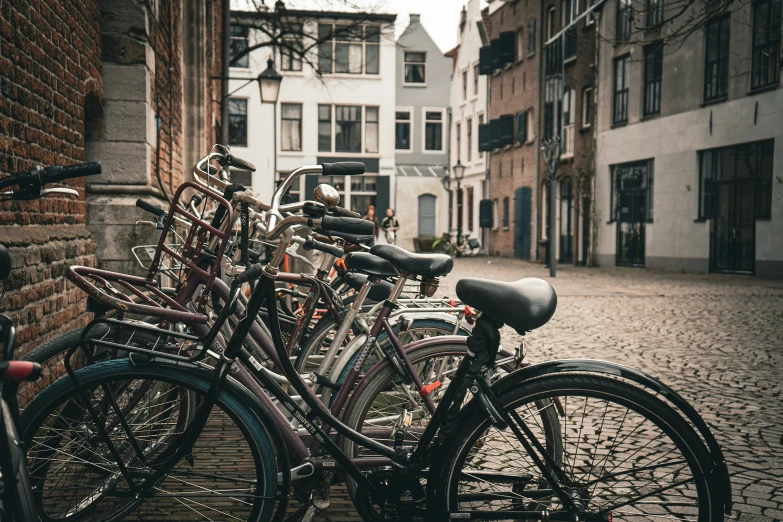 bicycles parked in a row along an alleyway