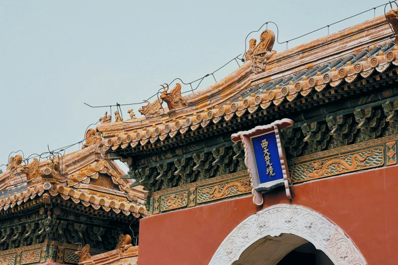 a street sign that is near some ornate buildings