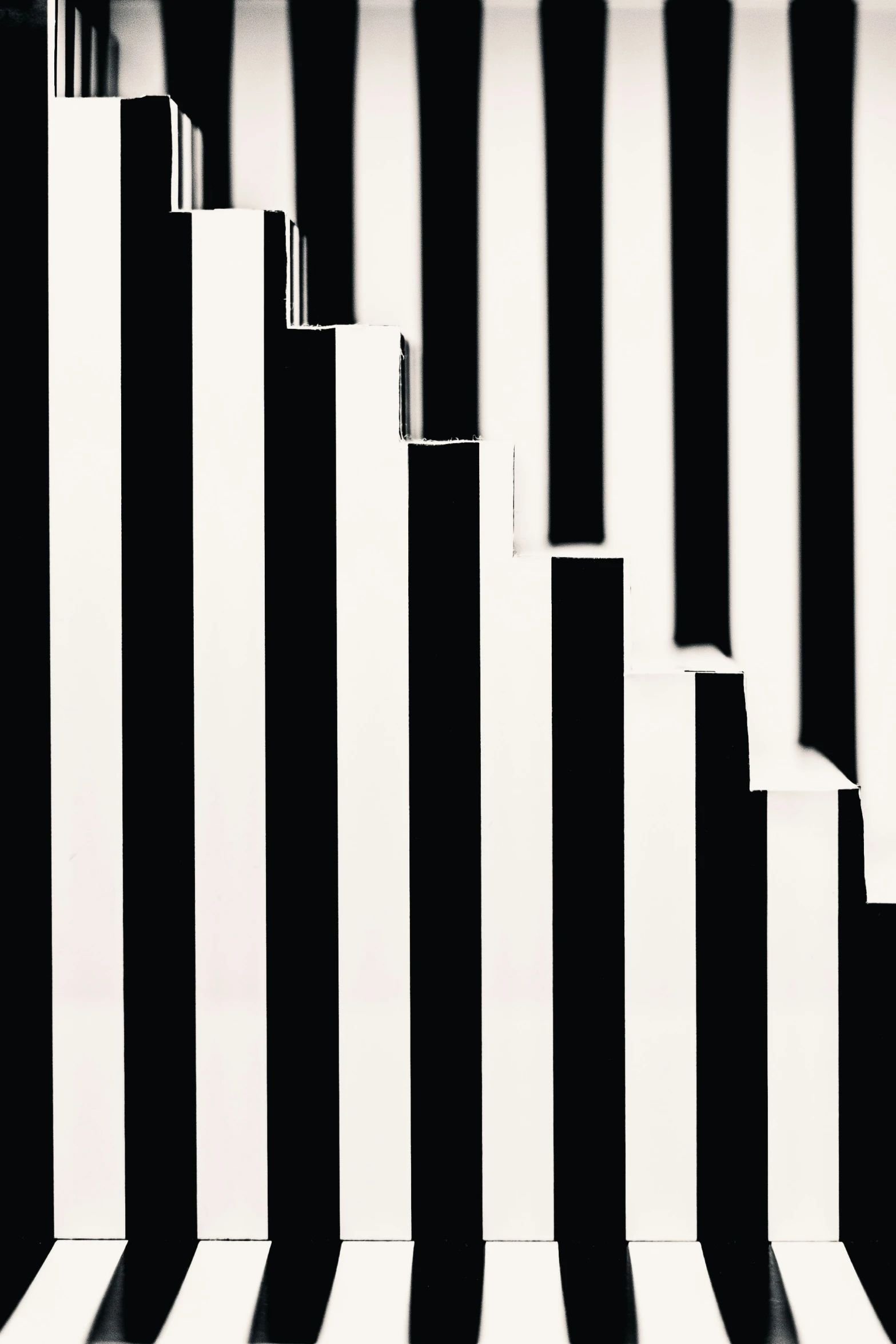 a person walking past a tall building with stripes