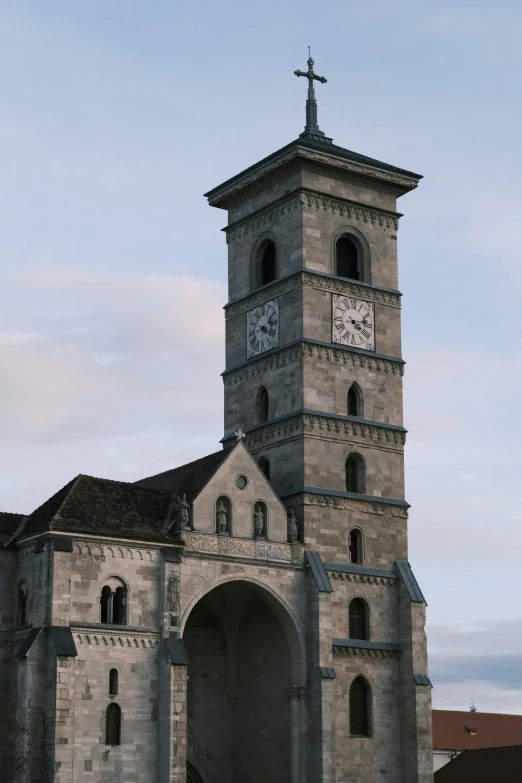 a large cathedral with clocks in the tower