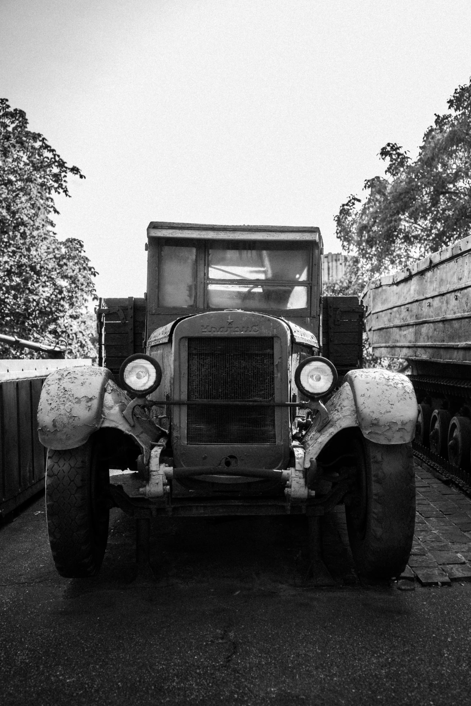 old trucks are lined up near one another