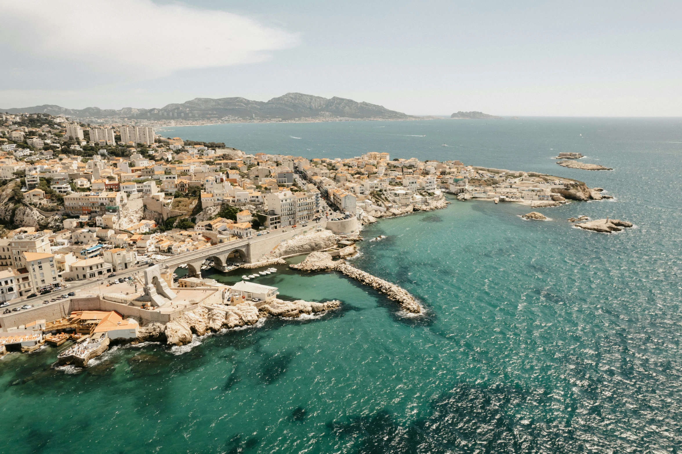 an aerial view of a harbor and a city