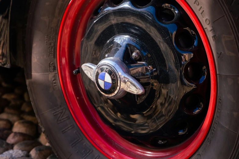 close up of red rims and a wheel of a motorcycle